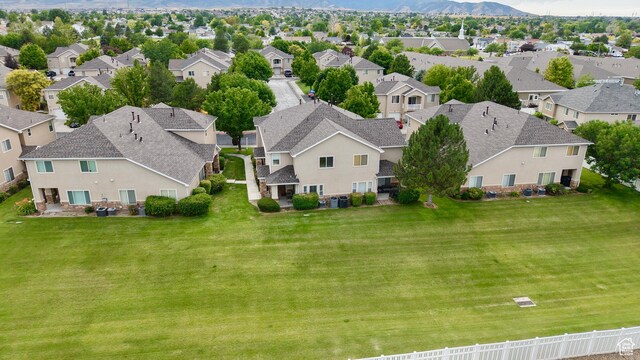 7089 S Brittany Town Dr, West Jordan, UT 84084 - aerial perspective of suburban area with a mountainous background