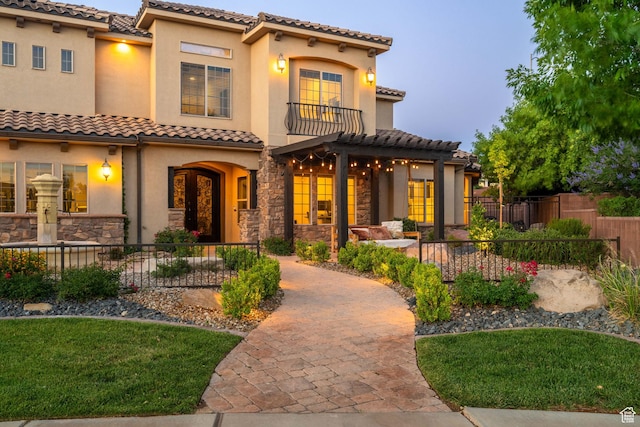 2979 E 3610th Cir S, St George, UT 84790 - mediterranean / spanish-style home with a tiled roof, stucco siding, a balcony, stone siding, and a pergola