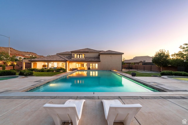 2979 E 3610th Cir S, St George, UT 84790 - pool at dusk featuring a patio
