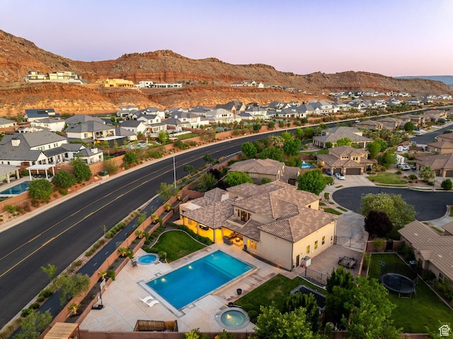 2979 E 3610th Cir S, St George, UT 84790 - aerial view at dusk of a residential view, a mountain view, and view of pool