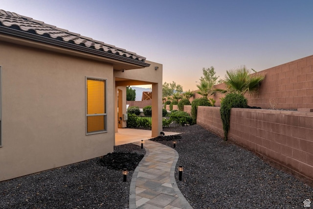 2979 E 3610th Cir S, St George, UT 84790 - yard at dusk featuring a fenced backyard and a patio