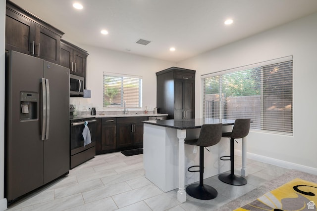 2979 E 3610th Cir S, St George, UT 84790 - kitchen with appliances with stainless steel finishes, a breakfast bar, plenty of natural light, a center island, and recessed lighting