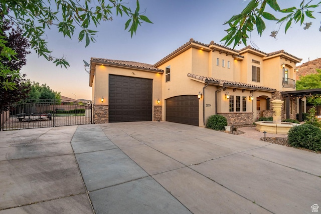 2979 E 3610th Cir S, St George, UT 84790 - mediterranean / spanish house with stone siding, driveway, stucco siding, and a gate