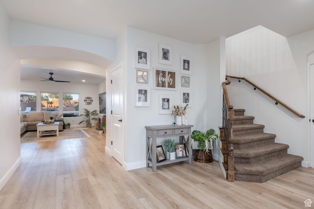 2979 E 3610th Cir S, St George, UT 84790 - staircase featuring wood finished floors, ceiling fan, and arched walkways