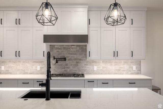 2979 E 3610th Cir S, St George, UT 84790 - kitchen featuring white cabinets, tasteful backsplash, and hanging light fixtures