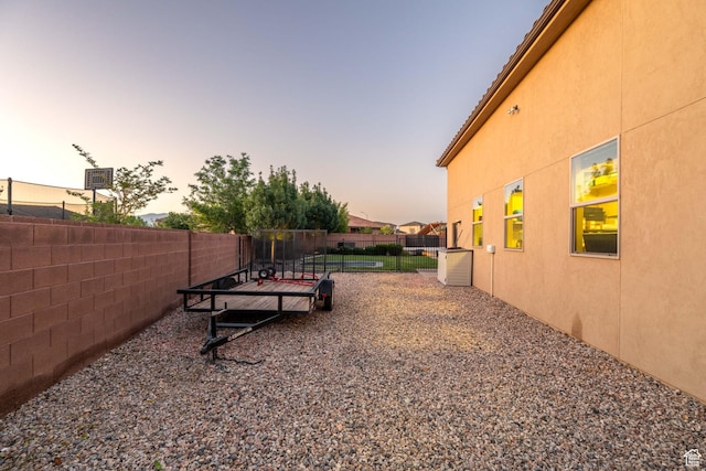 2979 E 3610th Cir S, St George, UT 84790 - yard at dusk featuring a fenced backyard