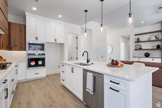 794 S 1690 W, Hurricane, UT 84737 - kitchen featuring stainless steel appliances, light wood-style flooring, light countertops, decorative backsplash, and recessed lighting