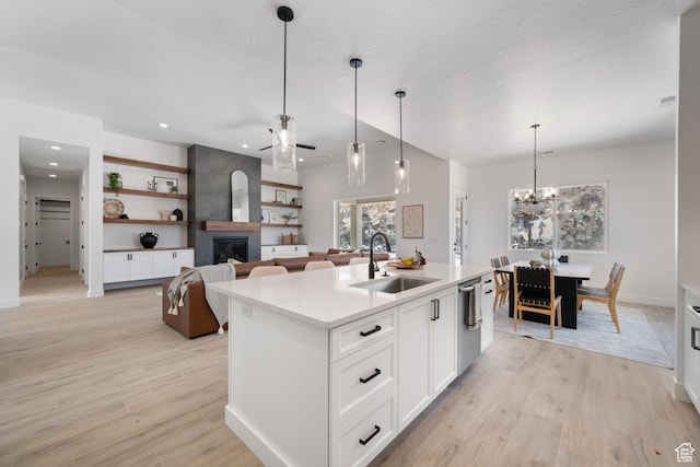 794 S 1690 W, Hurricane, UT 84737 - kitchen with a fireplace, dishwasher, light wood-type flooring, a kitchen island with sink, and ceiling fan