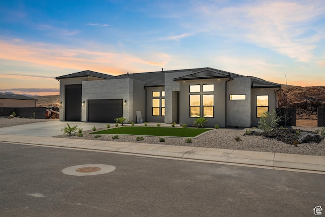 794 S 1690 W, Hurricane, UT 84737 - modern home with an attached garage, driveway, stucco siding, a tile roof, and a front yard