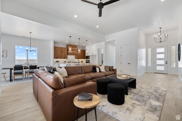 794 S 1690 W, Hurricane, UT 84737 - living room featuring a chandelier, a ceiling fan, light wood-style floors, and recessed lighting