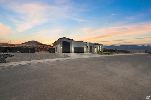 794 S 1690 W, Hurricane, UT 84737 - modern home with a mountain view, driveway, a garage, and stucco siding