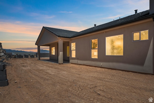 794 S 1690 W, Hurricane, UT 84737 - property exterior at dusk featuring a patio area and stucco siding