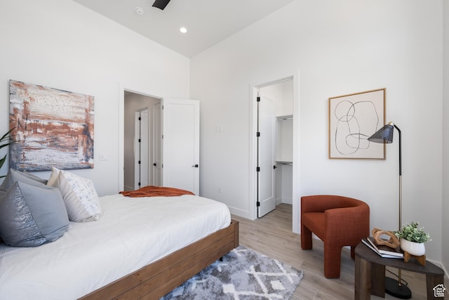 794 S 1690 W, Hurricane, UT 84737 - bedroom featuring light wood-style flooring, a walk in closet, a high ceiling, and a closet