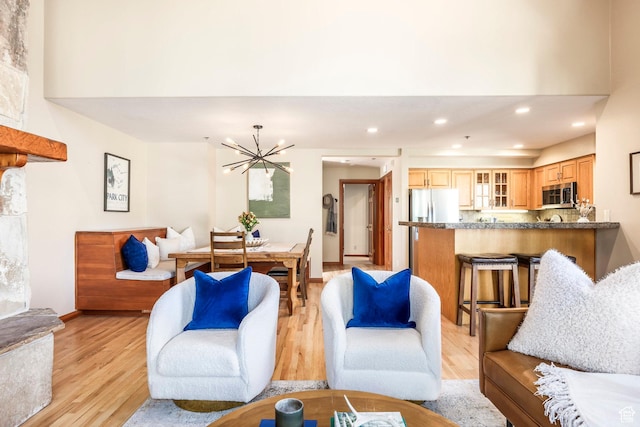 7560 Ridge Dr Unit 10, Park City, UT 84060 - living area featuring light wood-style floors, a chandelier, and recessed lighting