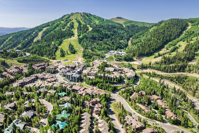 7560 Ridge Dr Unit 10, Park City, UT 84060 - aerial view of residential area featuring a forest and a mountain backdrop