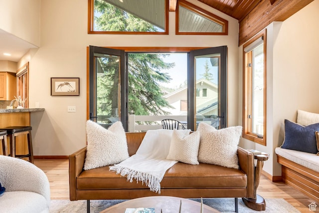 7560 Ridge Dr Unit 10, Park City, UT 84060 - living area featuring light wood-style flooring, wood ceiling, and high vaulted ceiling