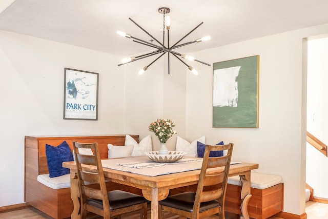 7560 Ridge Dr Unit 10, Park City, UT 84060 - dining room with a chandelier, breakfast area, and light wood-type flooring