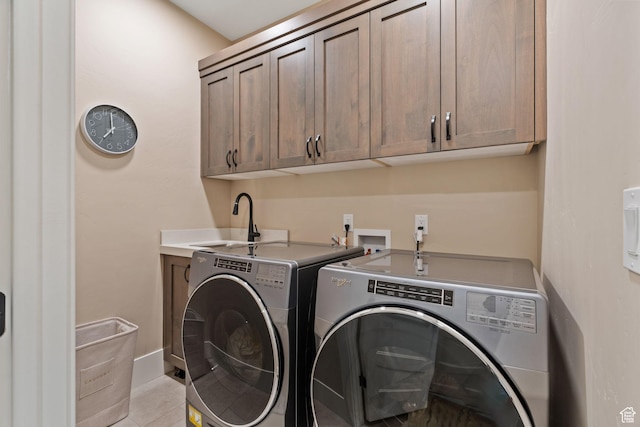 11422 N Vantage Ln Unit 69, Hideout, UT 84036 - washroom featuring washer and dryer, cabinet space, and light tile patterned flooring