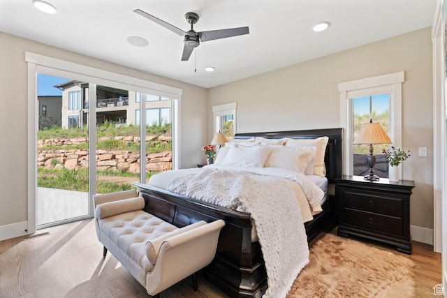 11422 N Vantage Ln Unit 69, Hideout, UT 84036 - bedroom featuring multiple windows, light wood-style flooring, access to outside, recessed lighting, and a ceiling fan