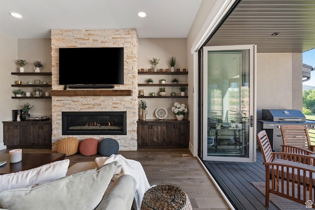 11422 N Vantage Ln Unit 69, Hideout, UT 84036 - living area with dark wood-style flooring, a stone fireplace, and recessed lighting