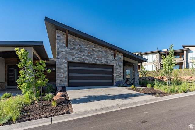 11422 N Vantage Ln Unit 69, Hideout, UT 84036 - modern home with stone siding, a garage, and driveway