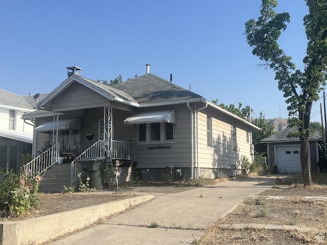 72 W 200 N, Price, UT 84501 - bungalow-style home with driveway, an outdoor structure, a porch, and a garage
