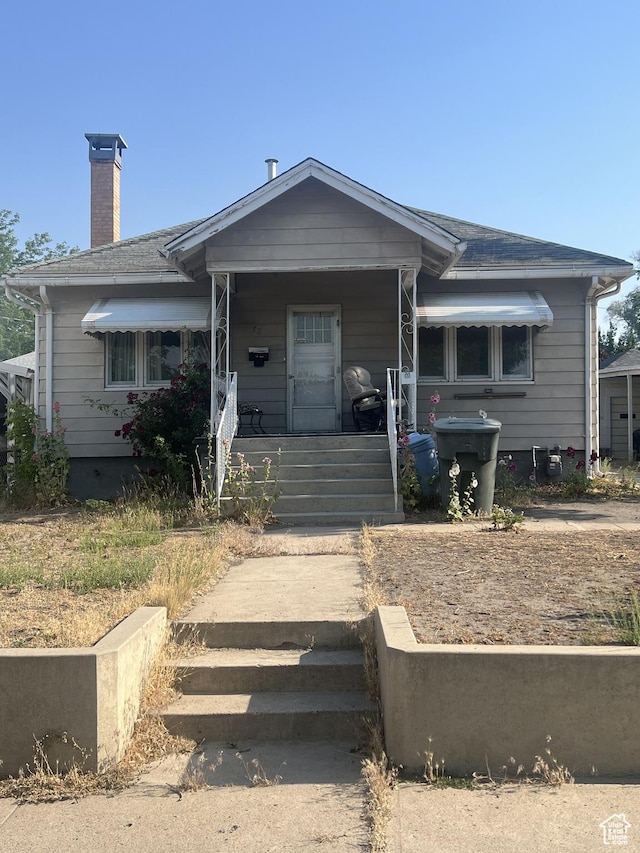 72 W 200 N, Price, UT 84501 - bungalow-style home featuring covered porch and a chimney