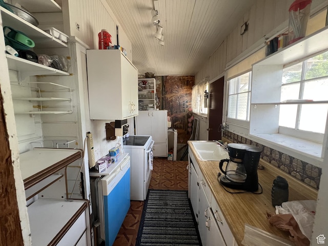 72 W 200 N, Price, UT 84501 - kitchen featuring range, light countertops, track lighting, white cabinets, and open shelves
