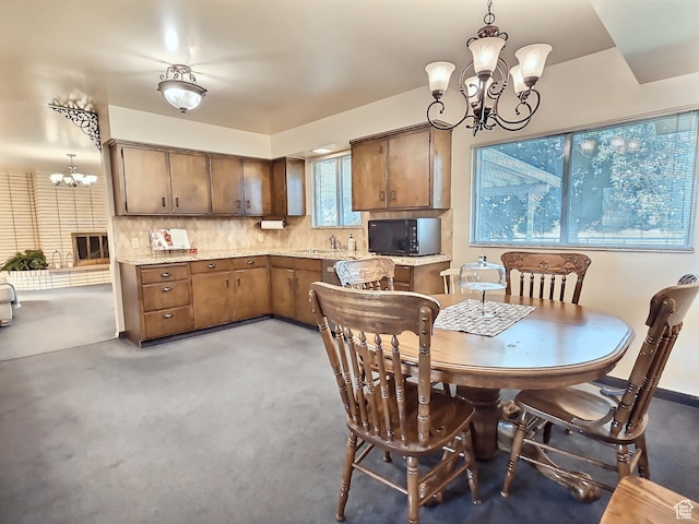 1425 W Main St, Vernal, UT 84078 - dining space with a chandelier and light carpet
