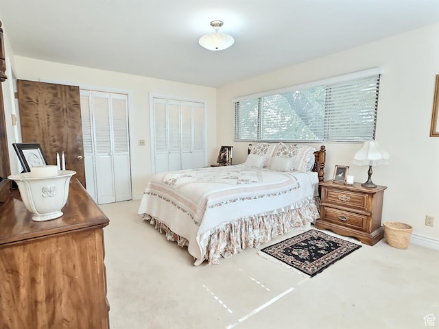 1425 W Main St, Vernal, UT 84078 - bedroom featuring two closets and light carpet