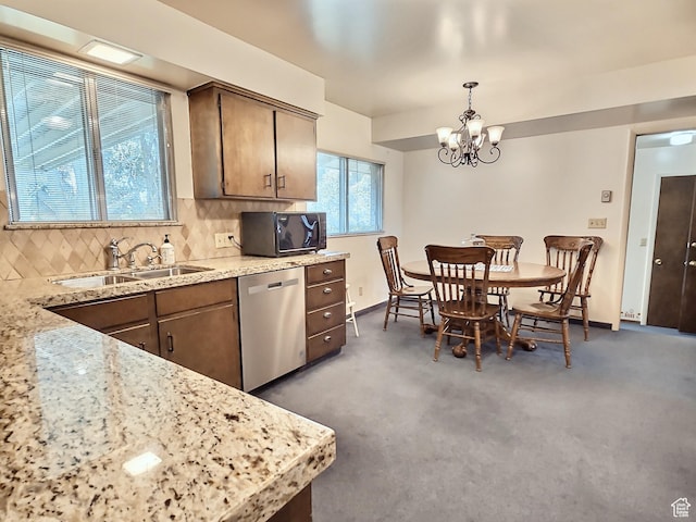1425 W Main St, Vernal, UT 84078 - kitchen featuring black microwave, dishwasher, a chandelier, backsplash, and carpet floors