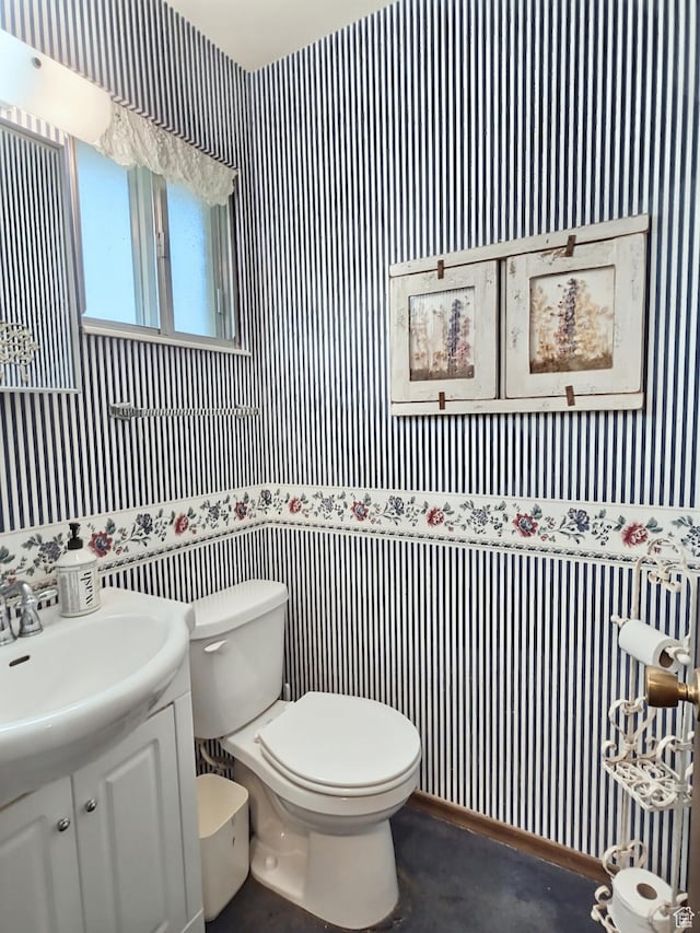 1425 W Main St, Vernal, UT 84078 - half bathroom featuring wallpapered walls, vanity, and concrete flooring
