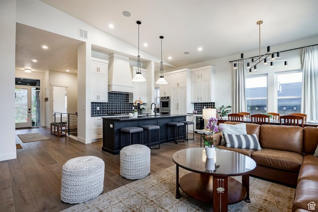 11795 N Star Gazer Cir, Hideout, UT 84036 - living area featuring wood finished floors and recessed lighting