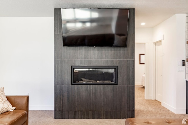 11795 N Star Gazer Cir, Hideout, UT 84036 - carpeted living room featuring a glass covered fireplace and baseboards