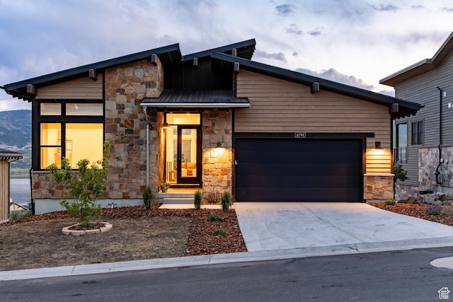 11795 N Star Gazer Cir, Hideout, UT 84036 - modern home with stone siding, an attached garage, and concrete driveway