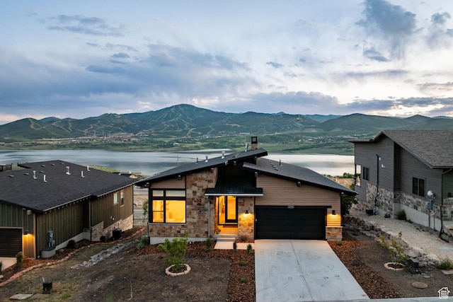 11795 N Star Gazer Cir, Hideout, UT 84036 - view of front of property featuring stone siding, a water and mountain view, and driveway