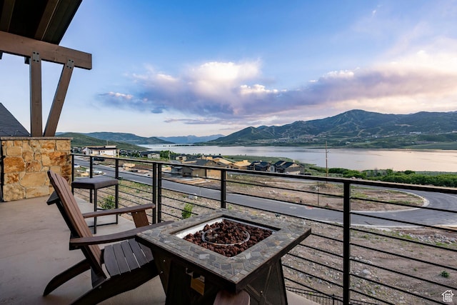 11795 N Star Gazer Cir, Hideout, UT 84036 - balcony with a fire pit and a water and mountain view