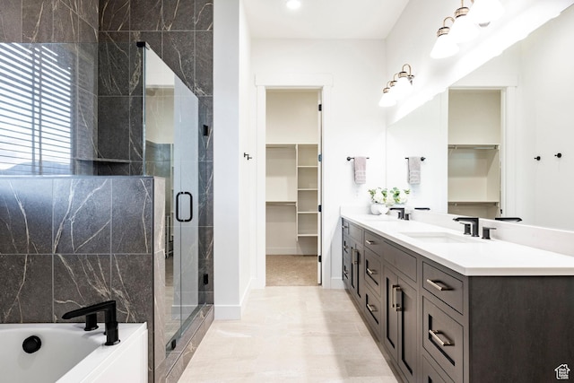 11795 N Star Gazer Cir, Hideout, UT 84036 - full bathroom with double vanity, a walk in closet, a shower stall, and a bath
