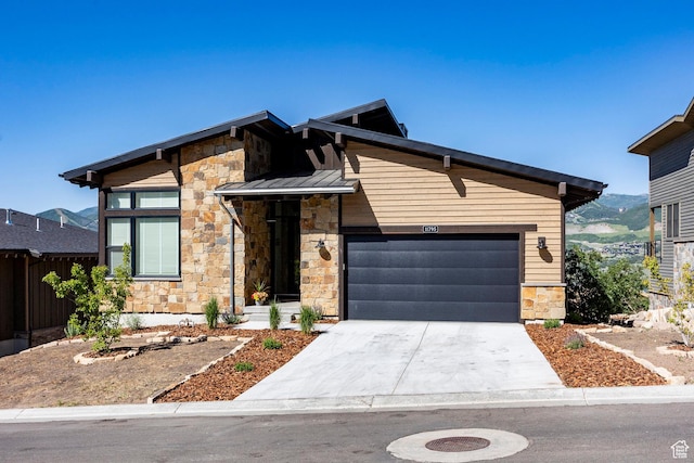 11795 N Star Gazer Cir, Hideout, UT 84036 - view of front of house with stone siding, driveway, a garage, a standing seam roof, and a metal roof