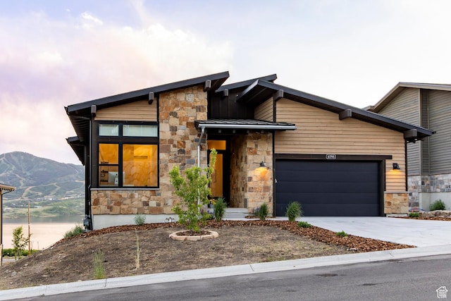 11795 N Star Gazer Cir, Hideout, UT 84036 - modern home featuring stone siding, driveway, and an attached garage