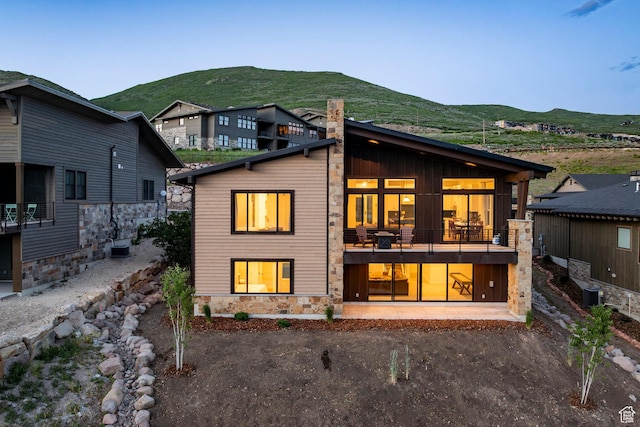 11795 N Star Gazer Cir, Hideout, UT 84036 - back of house with stone siding and a mountain view