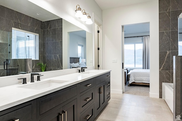 11795 N Star Gazer Cir, Hideout, UT 84036 - full bathroom with connected bathroom, tile walls, double vanity, a tub to relax in, and a shower