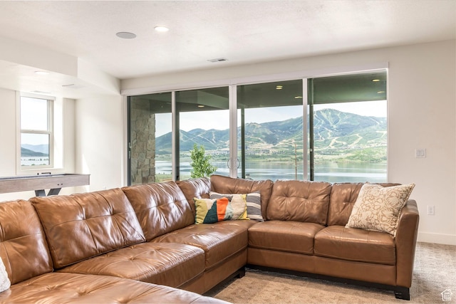 11795 N Star Gazer Cir, Hideout, UT 84036 - living area featuring light carpet, recessed lighting, and a water and mountain view