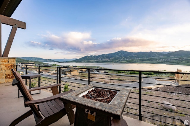 11795 N Star Gazer Cir, Hideout, UT 84036 - balcony with a water and mountain view and a fire pit