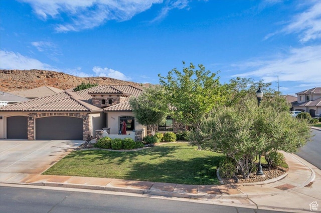 2644 E 3800 S, St George, UT 84790 - view of front of house featuring a tile roof, stucco siding, a garage, a front yard, and concrete driveway