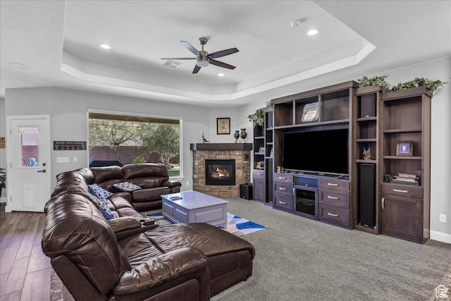 2644 E 3800 S, St George, UT 84790 - living room with a tray ceiling, ceiling fan, a stone fireplace, and recessed lighting