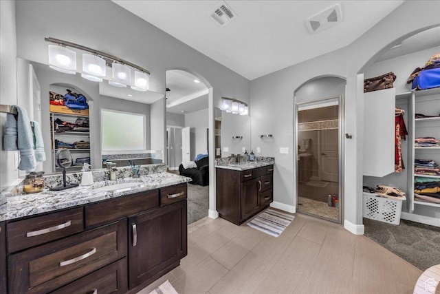 2644 E 3800 S, St George, UT 84790 - full bath featuring a walk in closet, a stall shower, and two vanities