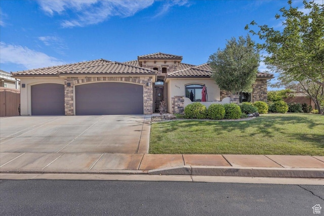 2644 E 3800 S, St George, UT 84790 - mediterranean / spanish-style home featuring a tile roof, a garage, stucco siding, and concrete driveway