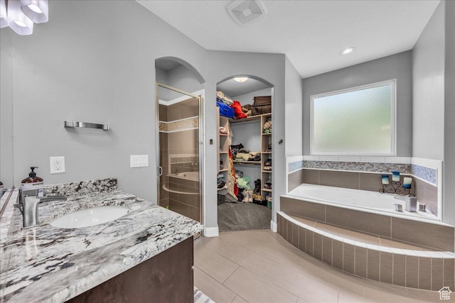 2644 E 3800 S, St George, UT 84790 - bathroom featuring a shower stall, a walk in closet, a garden tub, vanity, and recessed lighting