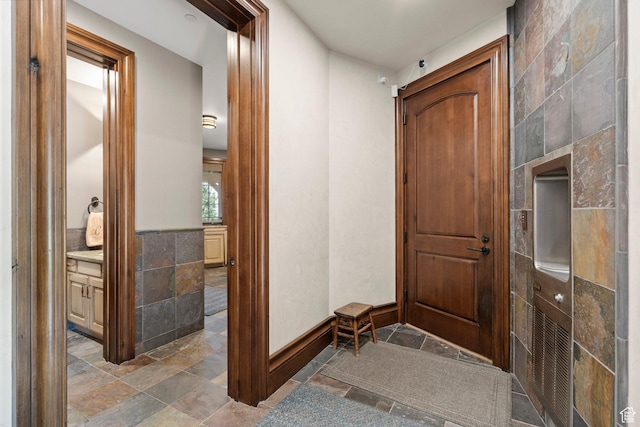1943 N Wolf Creek Ranch Rd Unit 12, Heber City, UT 84032 - entrance foyer featuring stone tile flooring and tile walls